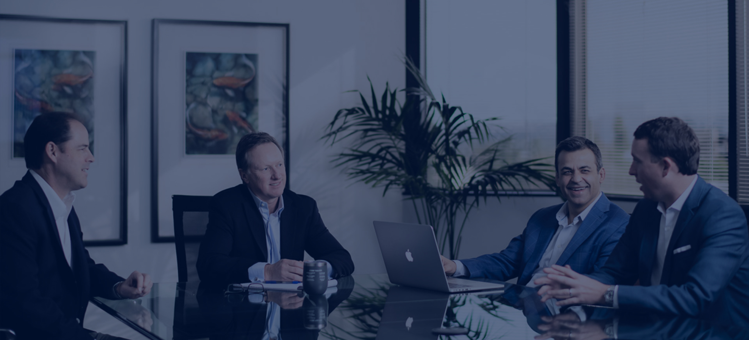 Team members talking in conference room