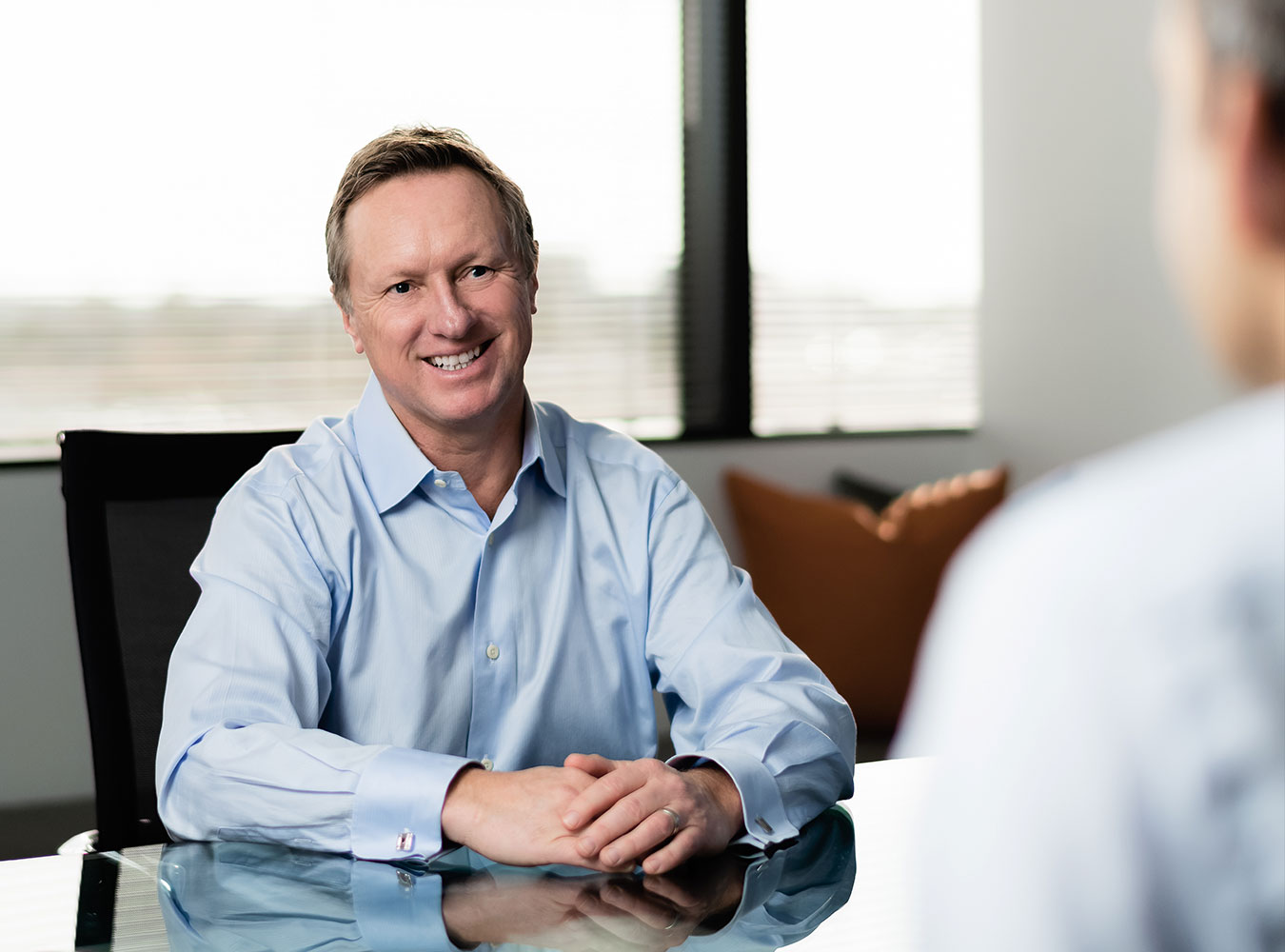 Charles Byerly talking with partner