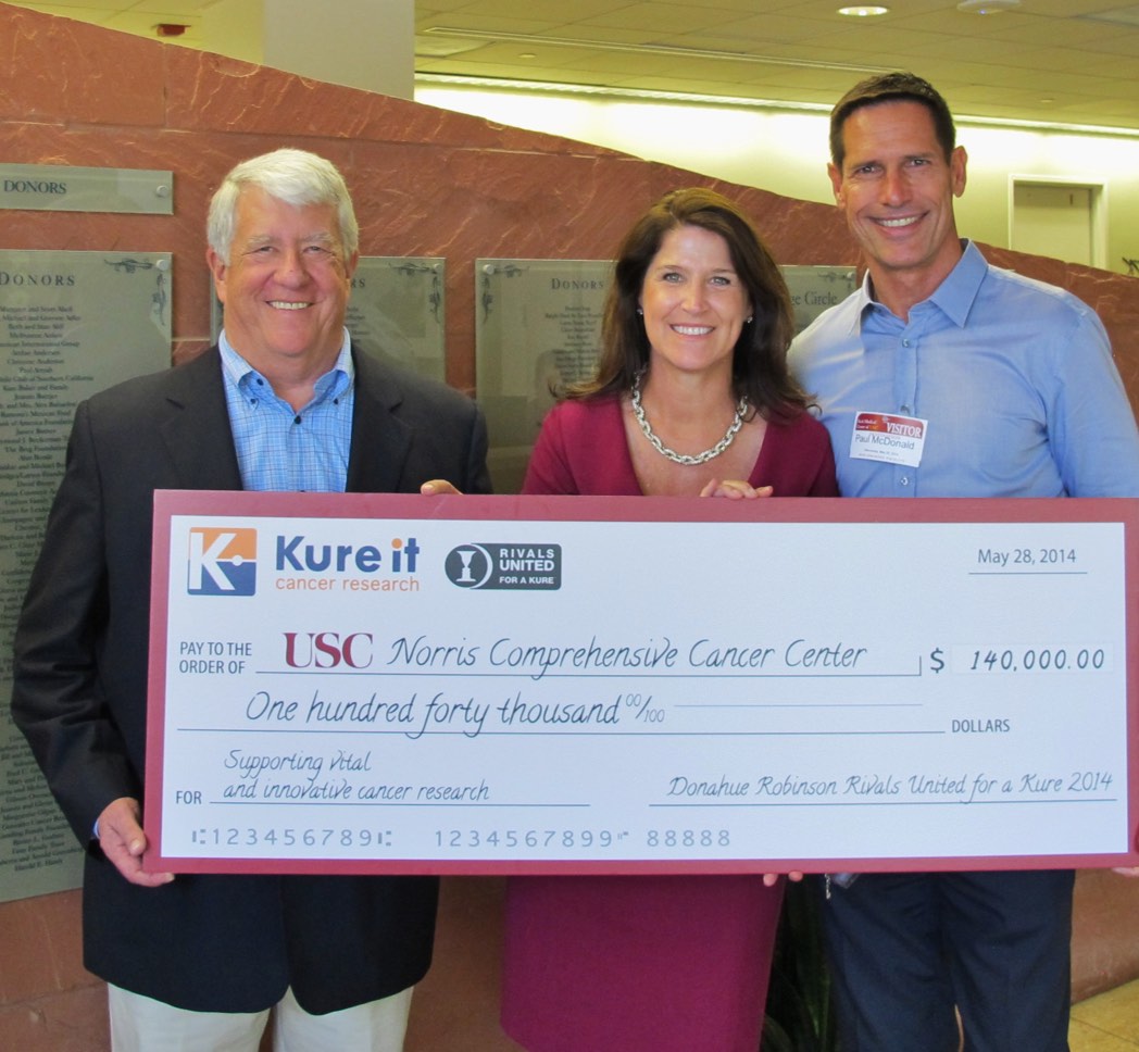 Barry with donors holding large donation check